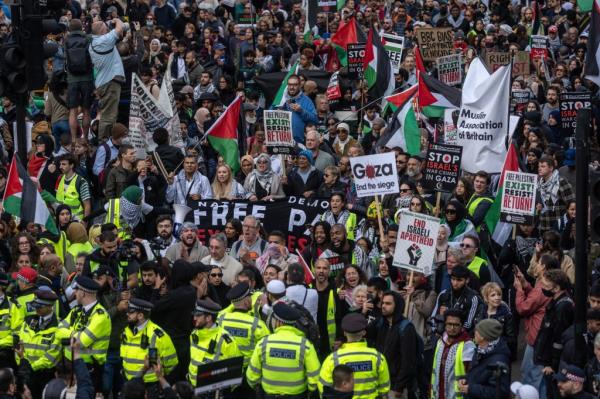 People take part in a demonstration in support of Palestine on October 14, 2023 in London, United Kingdom.