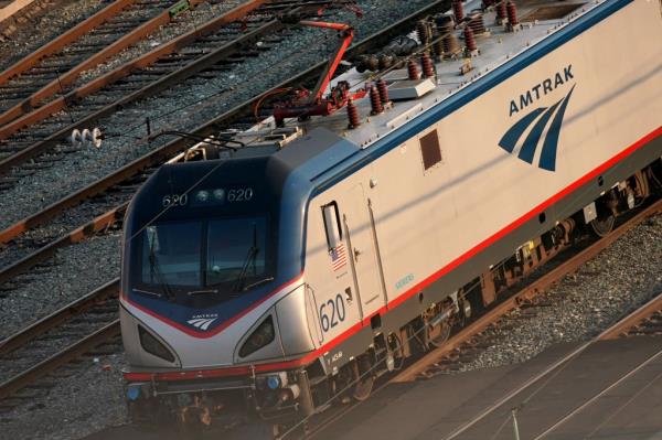 Front of Amtrak train on tracks in Washington, D.C. seen from above.