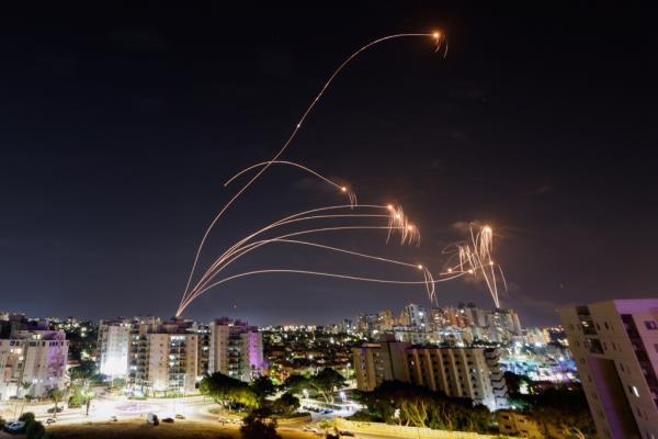 Israel's Iron Dome anti-missile system intercepts rockets launched from the Gaza Strip, as seen from the city of Ashkelon.