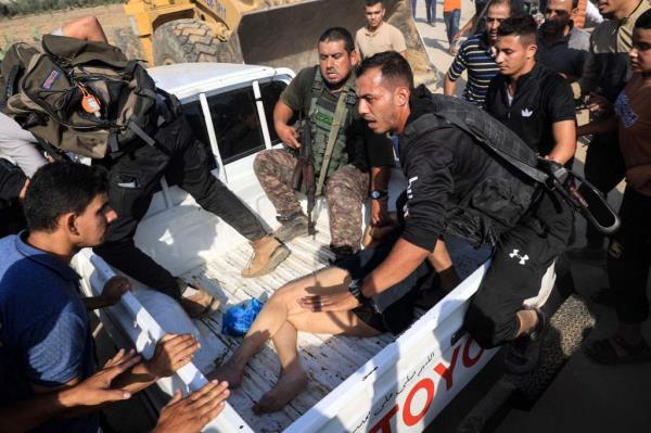 Hamas terrorists surround a truck reportedly carrying a captured Israeli woman.